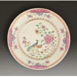 A Chinese export porcelain famille rose plate, c1780, painted with peafowl and peony, in red and