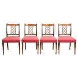 A set of four mahogany and line inlaid lattice back dining chairs, 19th c, on turned forelegs