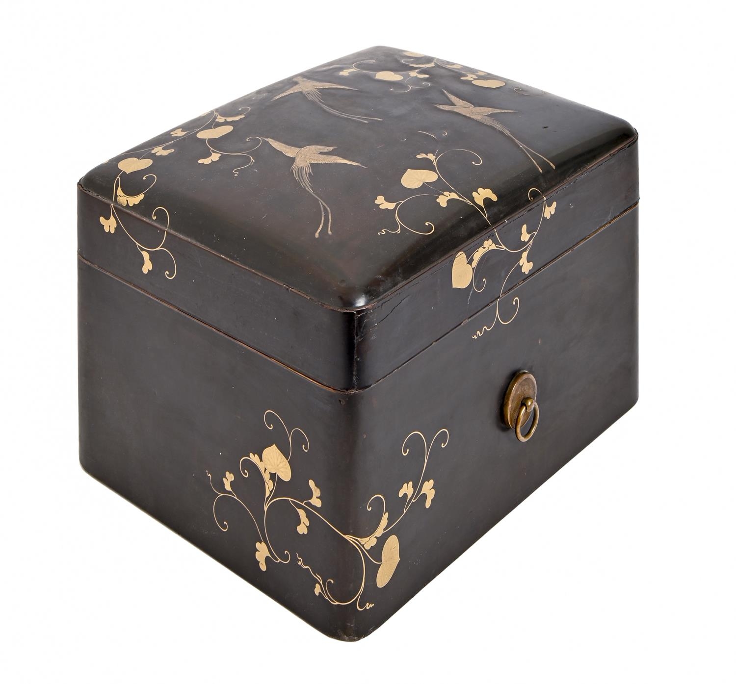 A Japanese lacquer box and cover, Meiji period, retaining a tray, decorated with long tailed birds