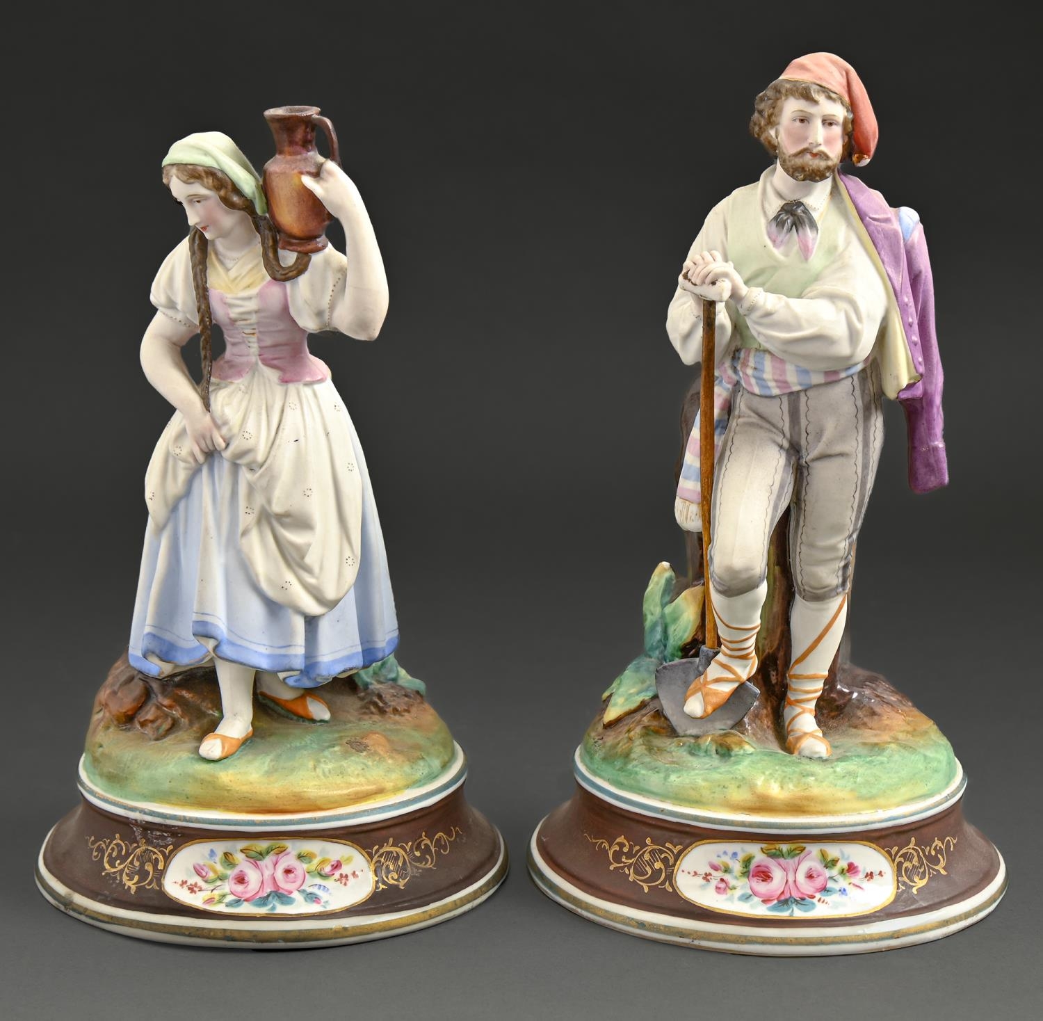 A pair of French biscuit porcelain figures of peasants, late 19th c, painted in a bright palette, on