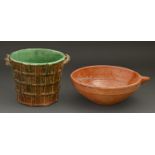 A rustic majolica cache pot, late 19th c, 18cm h and a glazed terracotta bowl (2) One handle of