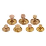 Six gold dress studs, marked 9ct, 4.5g and one other marked 15ct, 0.8g (7) Slight wear