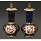 A pair of Staffordshire bone china vases, c1820,  painted with two panels of flowers reserved on a