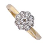 A diamond cluster ring, millegrain in 18ct gold, London 1990, 3g, size N Hoop of later date; good