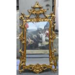 A giltwood and composition mirror, 139 x 68cm