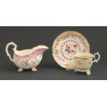 An H & R Daniel coffee cup and saucer, c1827, of C-scroll shape, painted with flowers, saucer 14.5cm