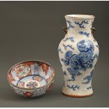 A Chinese moulded and crackle glazed blue and white vase, c1900, 35cm h and a Japanese Imari bowl,