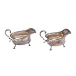 A pair of George V silver sauceboats, with gadrooned rim, on three hoof feet, 15cm l, by The
