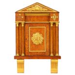 An architectural style parcel gilt burr maple hanging key cupboard, 20th c, the panelled door