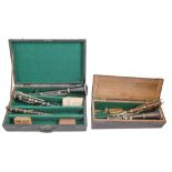 Musical instruments, comprising a French three piece ebony clarinet, another similar, rosewood,