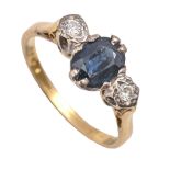 A sapphire and diamond three stone ring, illusion set, in 18ct gold, London 1971, 3.4g, size M