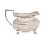 An Edwardian silver cream jug, 75mm h, by W G Keight & Co, Birmingham 1909, 4ozs 8dwts Good