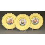 A set of three Minton yellow ground bone china plates, early 20th c,  printed and painted with
