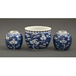 A Chinese blue and white prunus on cracked ice jardiniere and a pair of ginger jars, 19th / 20th