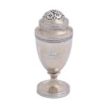 A George III silver pepper caster and threaded cover, of shield shape with reeded rims, crested,