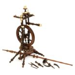 An ivory mounted turned and stained wood spinning wheel, late 19th c, 69cm h Please note Mellors &