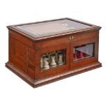 A Victorian oak games compendium, Royal Cabinet of Games, the lid with bevelled glazed light and