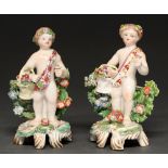 Two Bow figures of a child with a basket of flowers, c1770, naked save for a chaplet and sash, 13