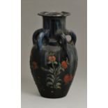 An Elton ware vase, c1900, with five loop handles and decorated with a butterfly and plants, 27cm h,