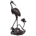 A Japanese bronze incense burner in the form of  a stork, Meiji period, standing on a lotus, 49cm