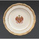 A Copeland armorial plate, late 19th c, finely painted in gilt with shield, helm, crest, motto