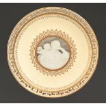 A Minton pate-sur-pate plate, c1890-1900, painted by Albion Birks with a young woman and Cupid,