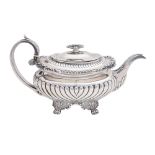 A George IV silver teapot, the gadrooned rim with shells at intervals, crested, handle with ivory