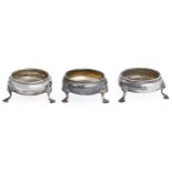 Three George III silver salt cellars, on hoof feet, 83mm diam and circa, all London, marks rubbed,