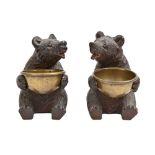 A pair of Swiss limewood and brass bear novelty salt cellars, early 20th c, black bead eyes, 85mm