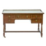 An oak dressing table, c1930, with brass gallery and inset glass top, on turned legs, stretcher base