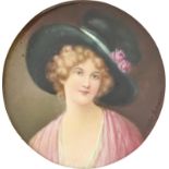 An English porcelain plaque, c1900, painted by Leslie Johnson, signed, with a fair haired young