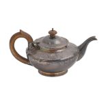 A Victorian silver teapot, engraved with scrolling foliage in Greek key borders, crested, 12cm h, by