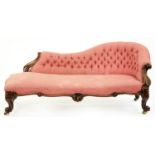 A Victorian rosewood chaise longue, the moulded frame carved with foliage, serpentine seat rail,