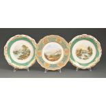 A pair of Davenport bone china dessert plates, c1865, painted with a landscape in chrome green and