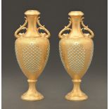 A pair of Coalport jewelled vases, c1900,  of shield shape with barbed panels of turquoise jewels on