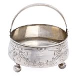 A Russian silver sugar basket, with swing handle, on ball feet, 11.5cm diam, by Vasily Sikachef,