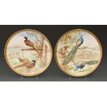 A pair of E J D Bodley bone china plaques, c1890,  painted by F Poole, both signed, with peasant or