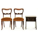 A Tudor style carved and dark-stained oak lidded stool and a pair of Victorian rosewood dining