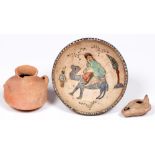 A Persian earthenware bowl, the painted and glazed interior with a figure on a camel, 17cm diam, a