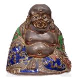 A South East Asian embossed copper and enamel figure of Budai, first half 20th c, 75mm h Old