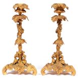 A pair of naturalistic gilt brass candlesticks, late 19th c, in the form of grapevines, 28cm h