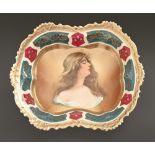 A Vienna style dish, early 20th c, printed and painted with the head of a raven haired beauty,
