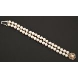 A cultured pearl bracelet, of two rows of approximately 8mm cultured pearls, 9ct gold clasp, 19cm l,