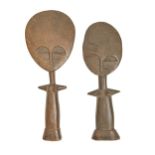 Tribal art. Two Ashanti female doll figures, first half 20th c, with disc head and projecting