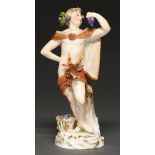 A Meissen figure of Bacchus as 'Autumn', c1900, 14cm h, incised 1696, underglaze blue crossed swords