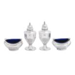 A George V silver condiment set, blue glass liners, pepperette 90mm h, by John Rose, Birmingham