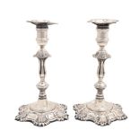 A pair of Elizabeth II cast silver candlesticks, in George II style, nozzles, 22.5cm h, by J B