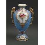A Japanese porcelain vase, early 20th c, painted with flowers in raised gilt reserves on a blue