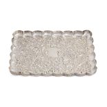 A Victorian die stamped silver dressing table tray,  with scalloped rim, 23cm l, by Mappin & Webb,