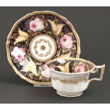 A Rockingham teacup and saucer, c1826-1835, of square handle shape, painted in a richly gilt set